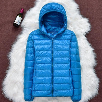 Nord - Chaqueta impermeable con plumón blanco de pato y diseño plegable