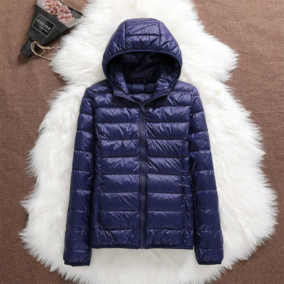Nord - Chaqueta impermeable con plumón blanco de pato y diseño plegable